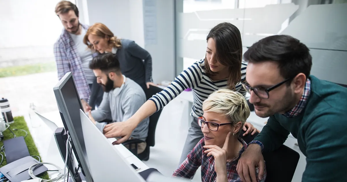 Employing Team-Based Agile Coaching to Establish SRE in an Organization
